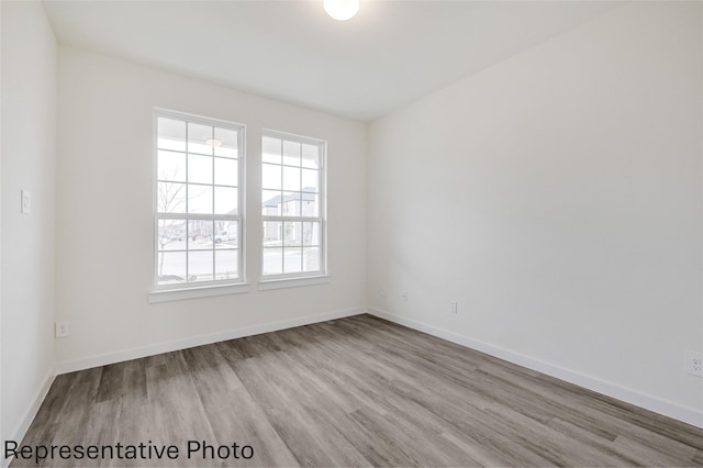 empty room with light hardwood / wood-style floors