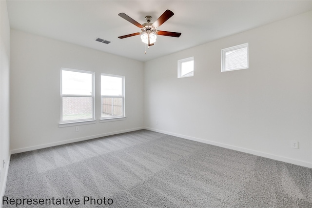 carpeted empty room with ceiling fan