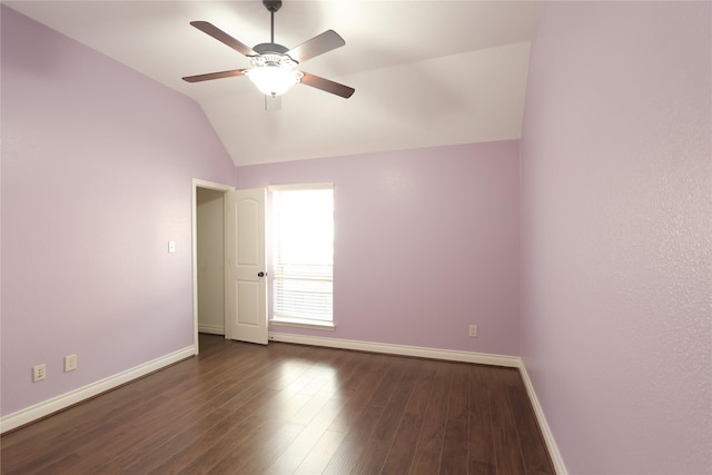 unfurnished room with dark wood-type flooring, lofted ceiling, ceiling fan, and baseboards