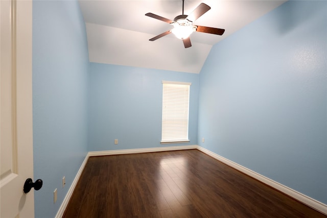 spare room with lofted ceiling, a ceiling fan, baseboards, and wood finished floors