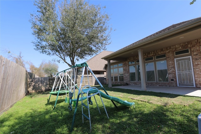 exterior space featuring a yard, a fenced backyard, and a patio