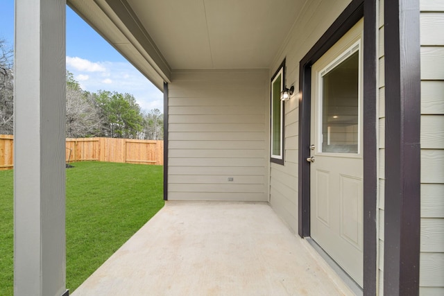 view of patio / terrace featuring fence