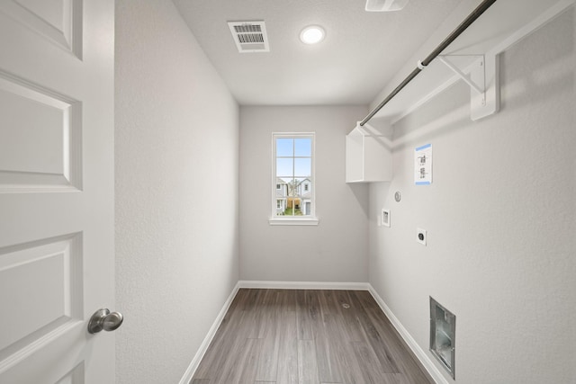 washroom featuring laundry area, baseboards, visible vents, washer hookup, and electric dryer hookup