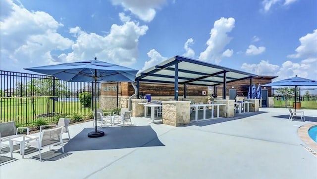 view of patio featuring an outdoor bar