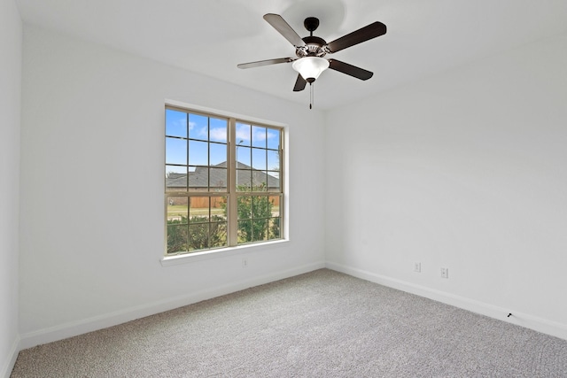 empty room featuring ceiling fan and carpet floors