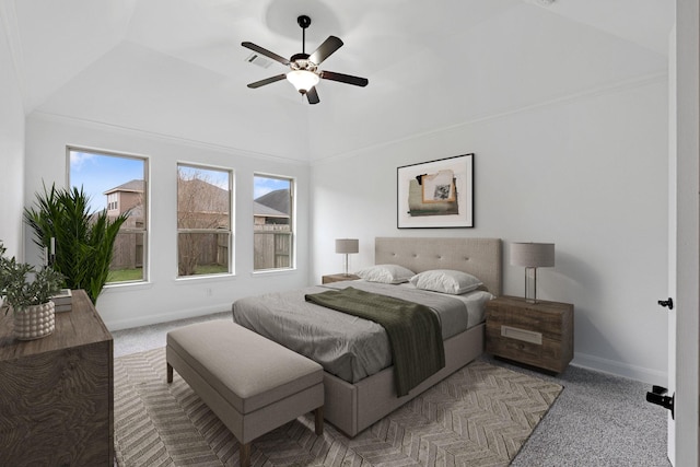 bedroom featuring light carpet, vaulted ceiling, and ceiling fan