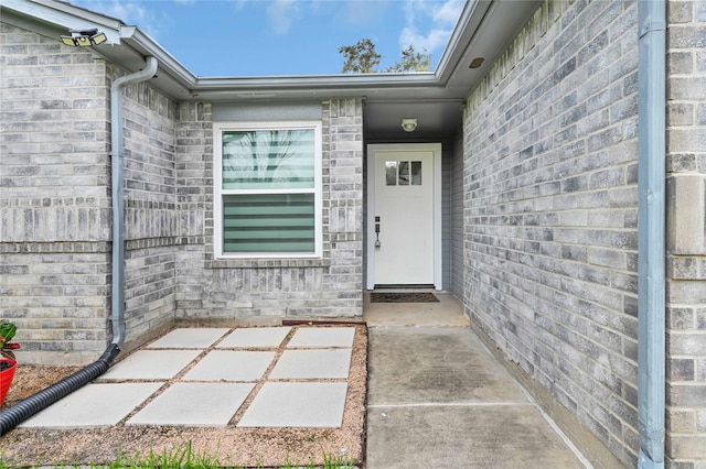 property entrance with a patio area