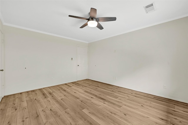 spare room with crown molding, light hardwood / wood-style floors, and ceiling fan