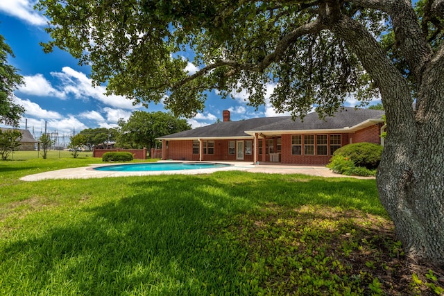 803 S Converse St, Flatonia, TX 78941 - rear view of property with a lawn and a patio area