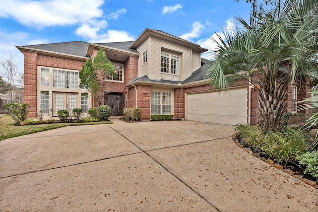 view of front of home with french doors and a garage