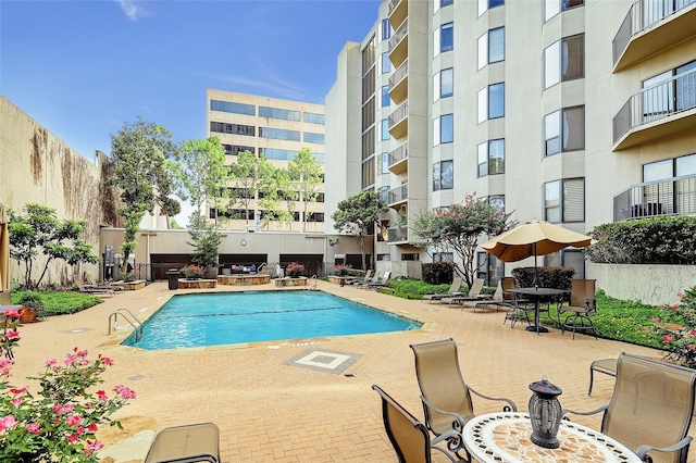 view of swimming pool featuring a patio