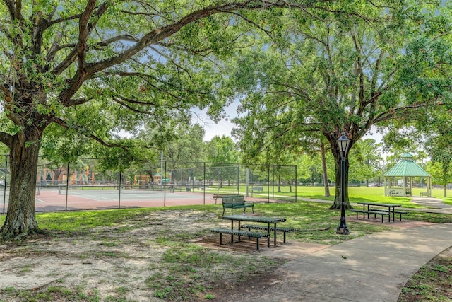 view of community featuring a gazebo and tennis court