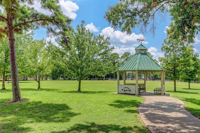 view of property's community with a gazebo and a lawn