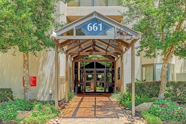 view of exterior entry featuring french doors