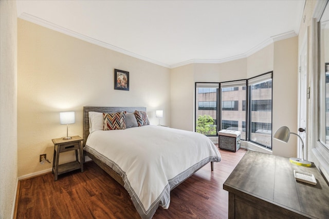 bedroom featuring ornamental molding and dark hardwood / wood-style floors