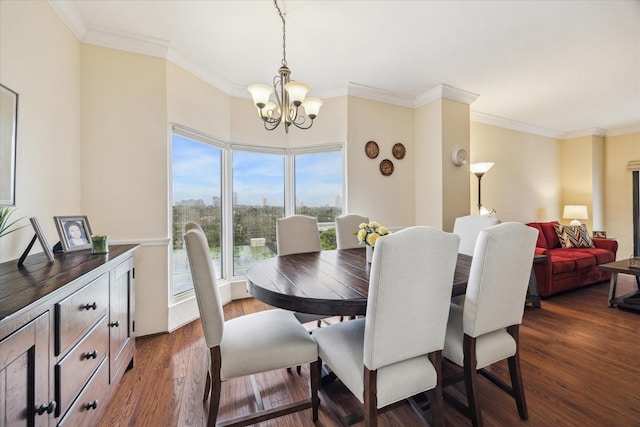 dining space featuring ornamental molding, dark hardwood / wood-style floors, and a chandelier