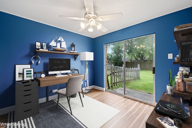 office space with wood-type flooring and ceiling fan