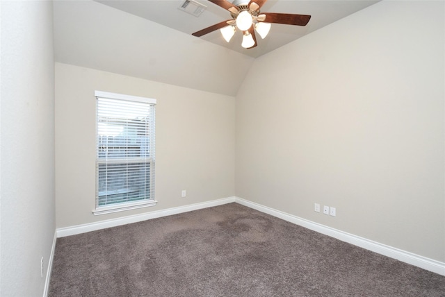 carpeted empty room featuring vaulted ceiling and ceiling fan