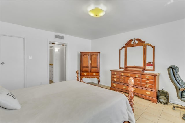 bedroom with light tile patterned floors