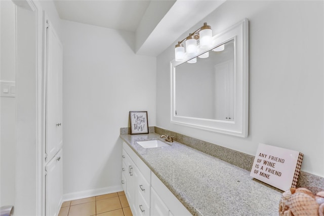 bathroom with tile patterned flooring and vanity