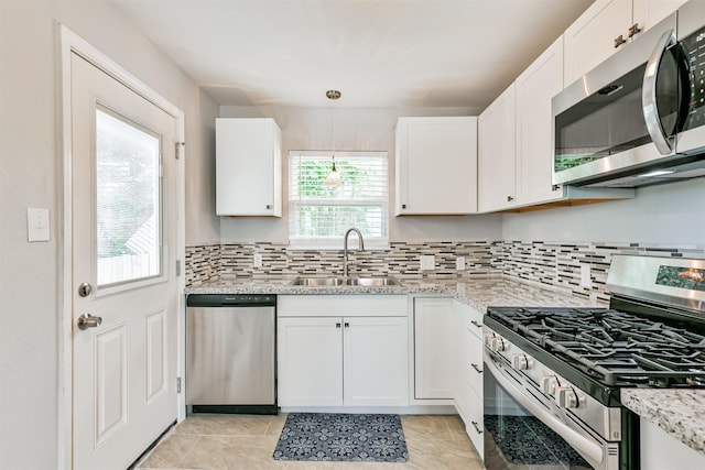 kitchen featuring white cabinetry, sink, and stainless steel appliances