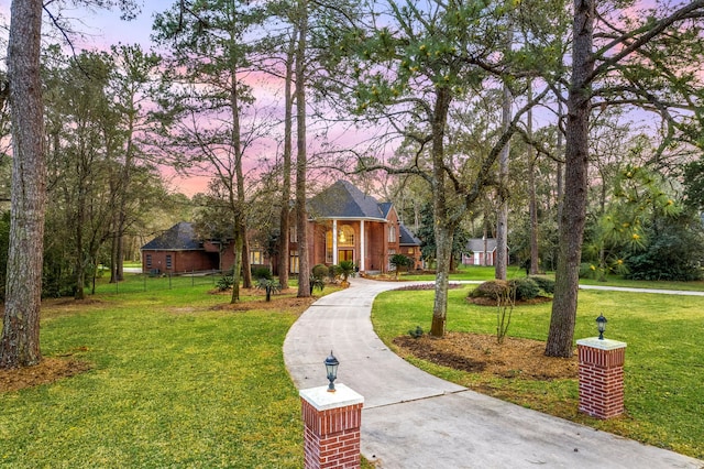 view of front of house with a front lawn and concrete driveway