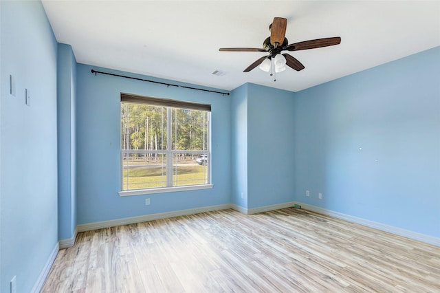 unfurnished room with ceiling fan and light hardwood / wood-style floors