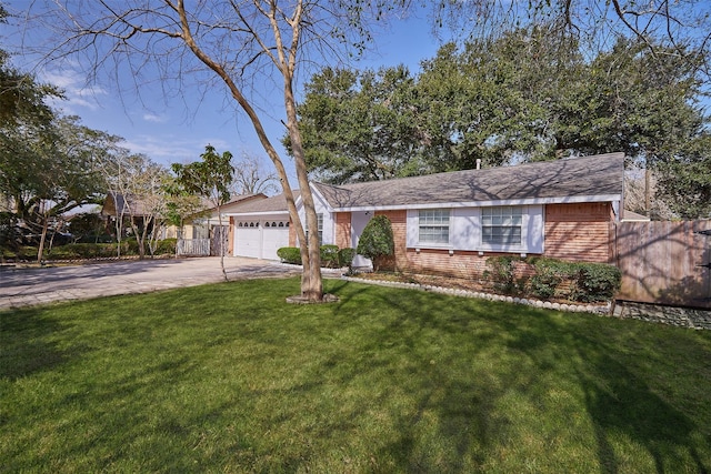 ranch-style home with a garage and a front yard