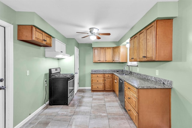 kitchen featuring sink, light stone countertops, ceiling fan, and appliances with stainless steel finishes