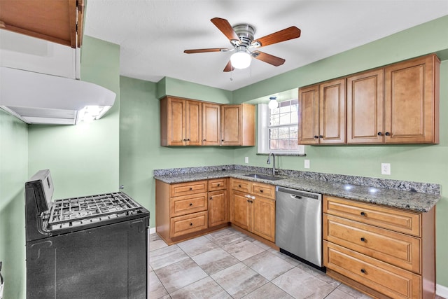 kitchen featuring sink, ceiling fan, range with gas stovetop, stainless steel dishwasher, and dark stone counters