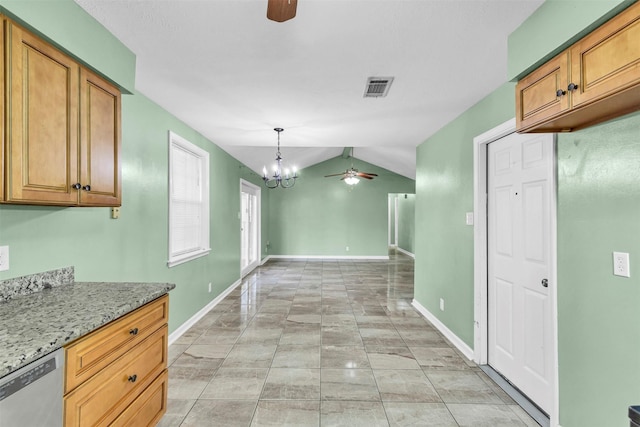 kitchen featuring vaulted ceiling, ceiling fan with notable chandelier, dishwasher, hanging light fixtures, and light stone counters