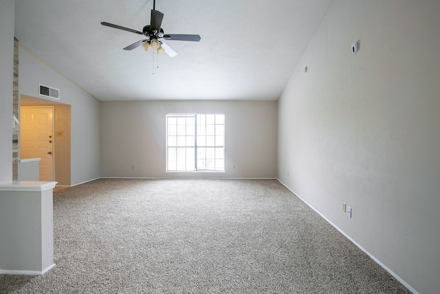 carpeted spare room with vaulted ceiling and ceiling fan