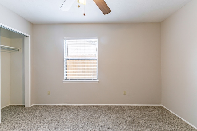 unfurnished bedroom featuring a closet, ceiling fan, and carpet