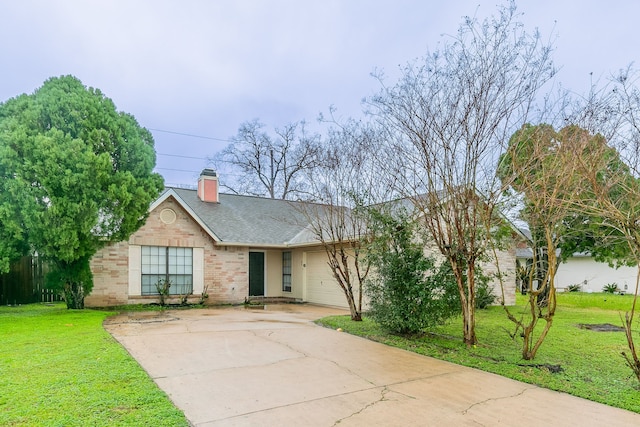 ranch-style house featuring a garage and a front lawn