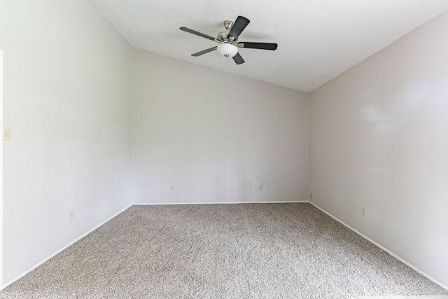 empty room with ceiling fan and carpet