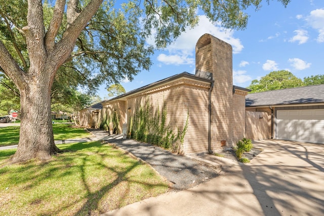 view of front of property with a garage and a front yard