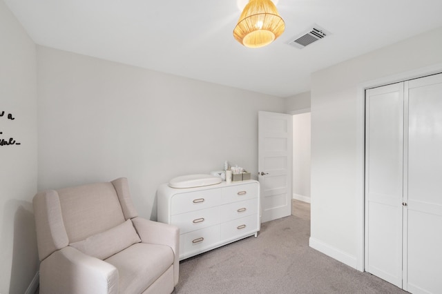 living area featuring light colored carpet