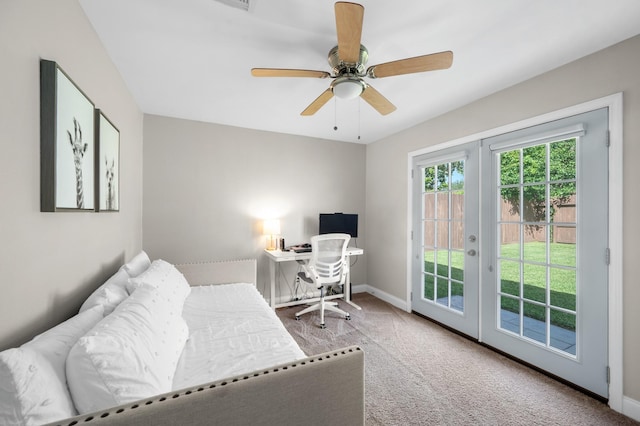 carpeted bedroom with french doors, ceiling fan, and access to exterior