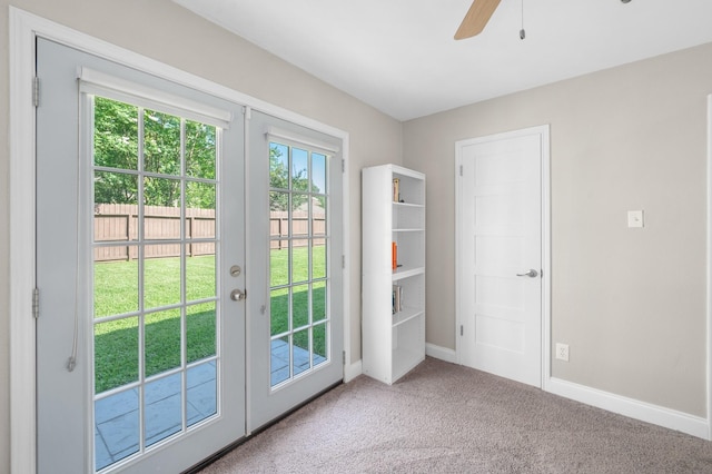 doorway to outside featuring plenty of natural light, carpet flooring, ceiling fan, and french doors