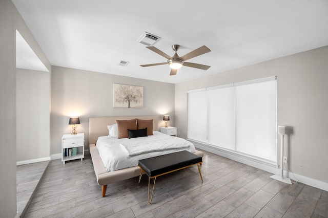 bedroom featuring hardwood / wood-style floors and ceiling fan