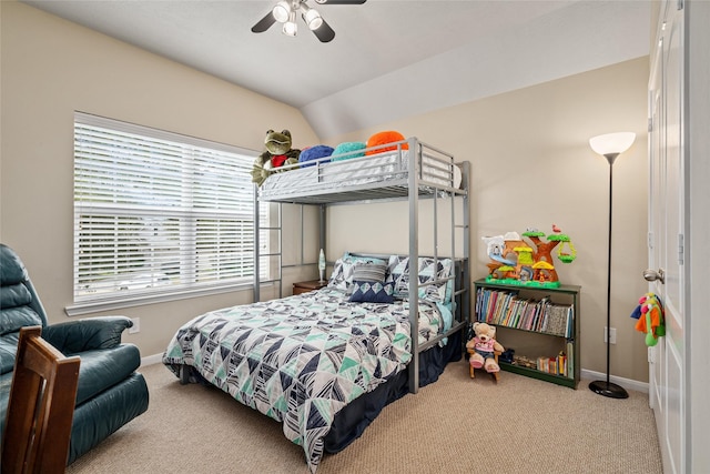 bedroom featuring vaulted ceiling, carpet, a ceiling fan, and baseboards