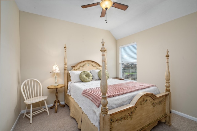 carpeted bedroom with a ceiling fan, vaulted ceiling, and baseboards