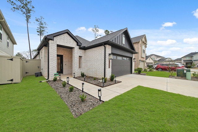 view of front of property featuring a garage and a front yard