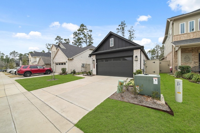 view of front of property featuring a garage and a front yard