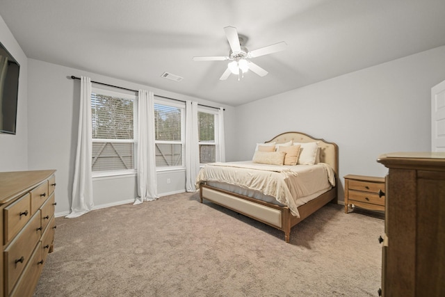 bedroom with light colored carpet and ceiling fan