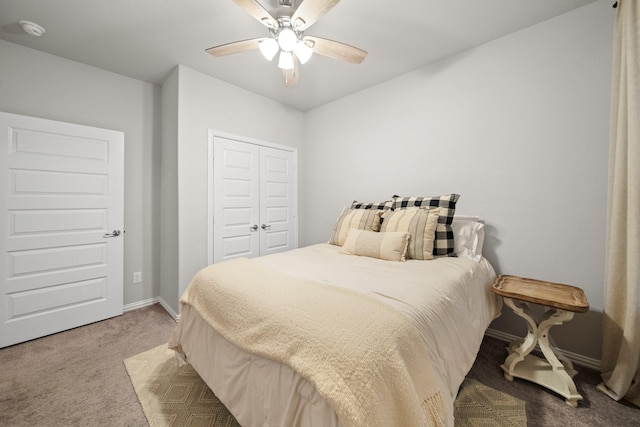 carpeted bedroom with a closet and ceiling fan