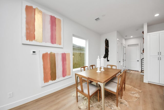 dining area featuring light wood-type flooring