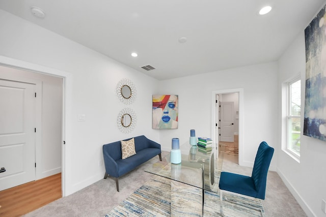 sitting room with carpet floors