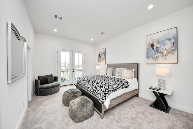 carpeted bedroom with access to outside and french doors