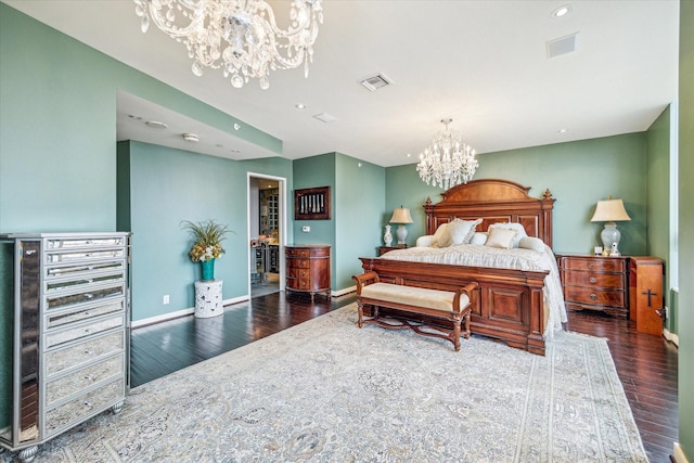 bedroom featuring dark hardwood / wood-style floors and an inviting chandelier